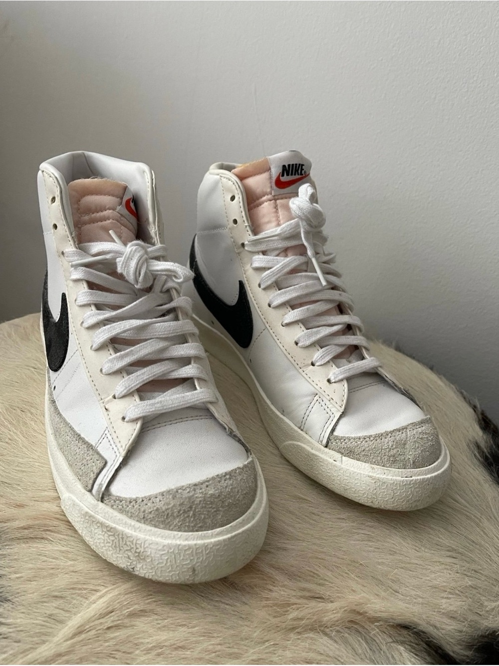 Nike White High-Top Sneakers with Black Swoosh